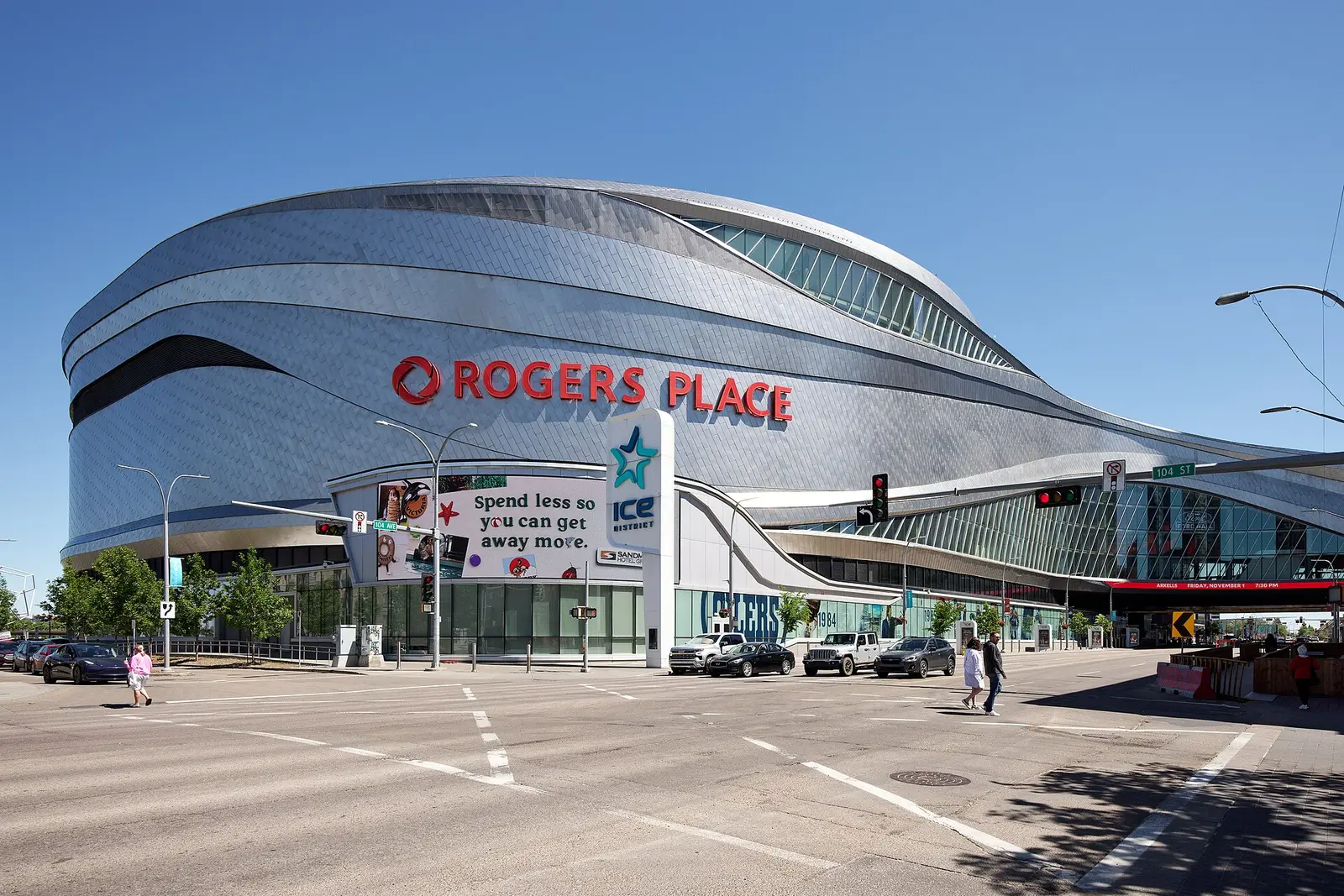 Rogers Place arena in Edmonton seen from the street under a blue sky
