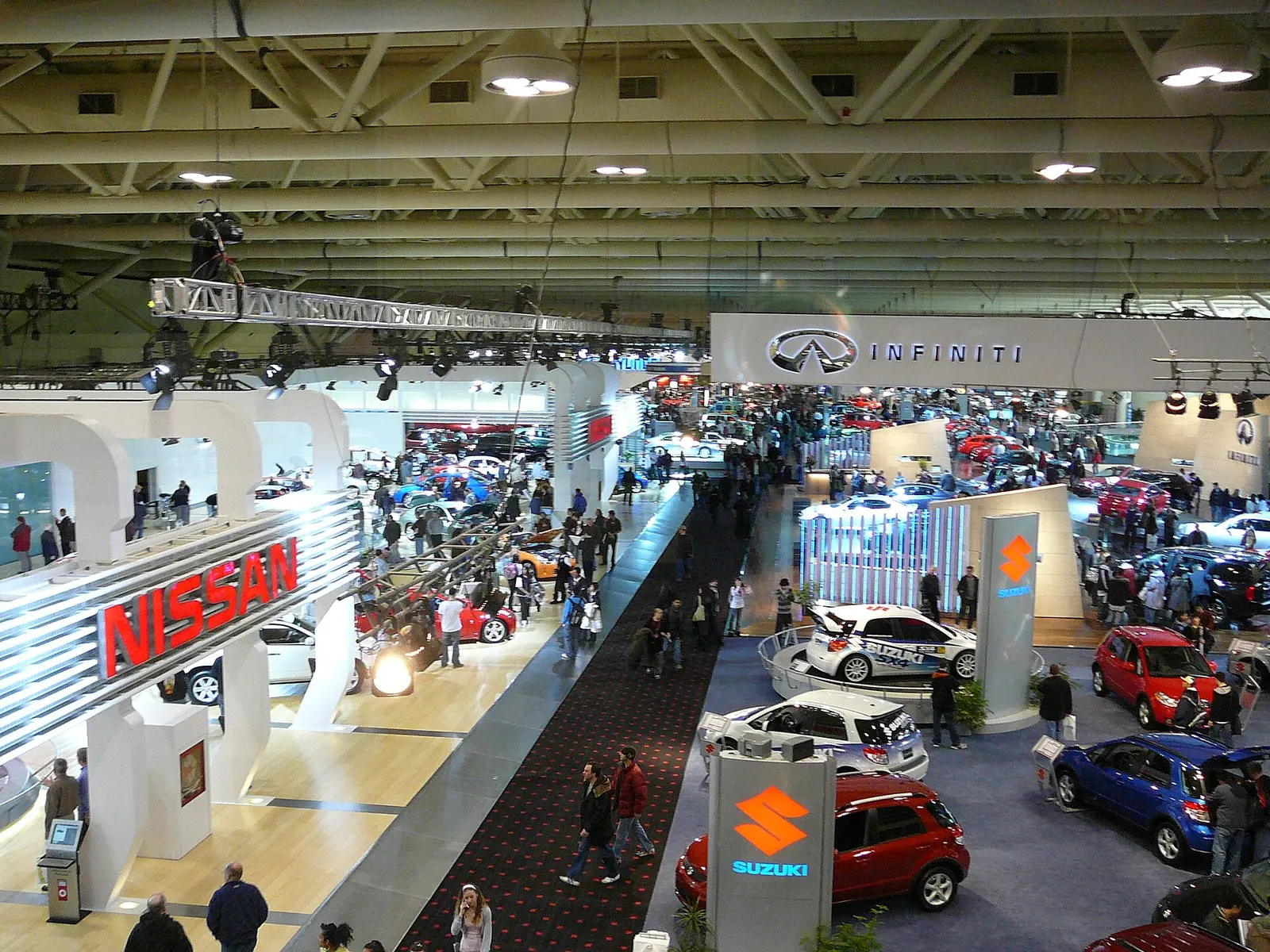 Crowds walking the aisles between car displays at the Canadian International AutoShow in Toronto