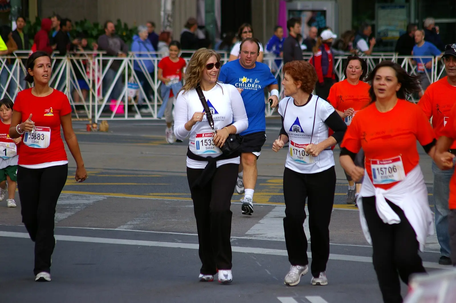 Runners and walkers along a Toronto street during the Scotiabank Waterfront Marathon